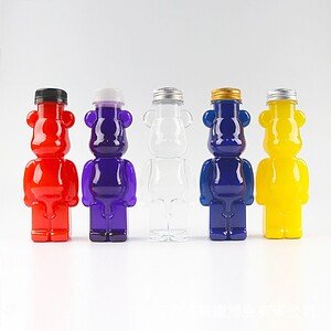 Red, purple, clear, blue, and yellow bear-shaped bottles for juice, made from food-grade plastic, di.
