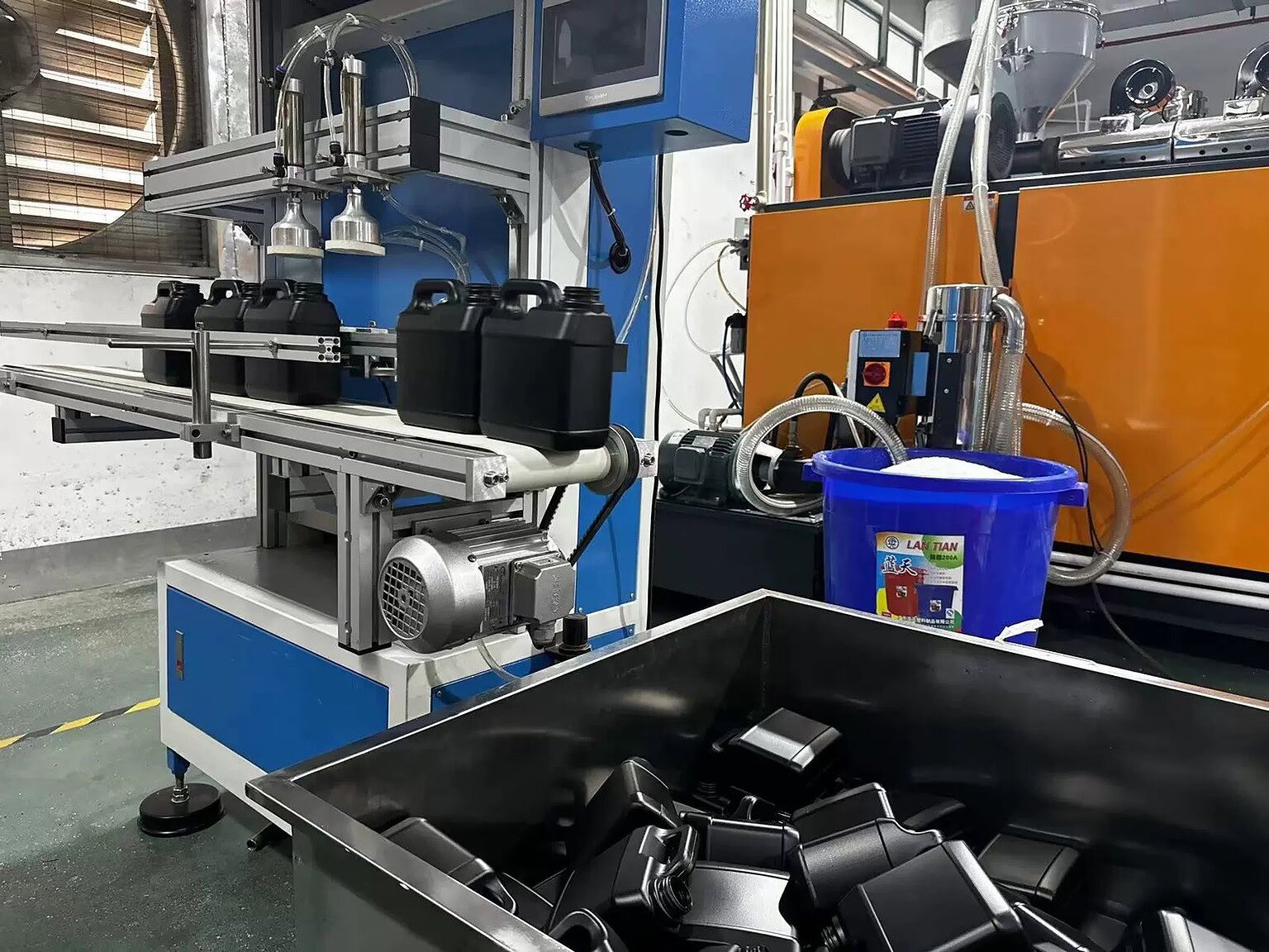 Automated machinery for producing custom glass and plastic bottles.