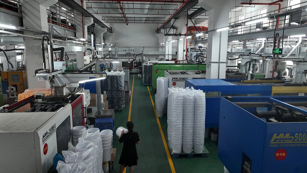 Modern manufacturing plant producing custom glass and plastic bottles and jugs.